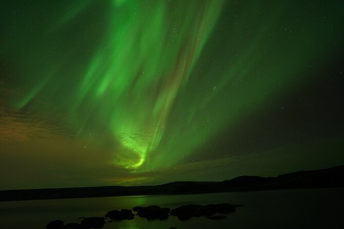 #1 Northern Lights Tour In Iceland from Reykjavik with PRO photos - Waiting Outside: Why You Might Sit Still for a While