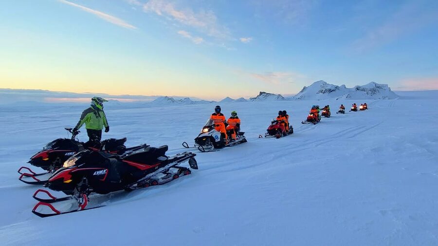 From Geysir: Snowmobile Adventure on Langjökull Glacier - Shared snowmobiles: the double-seat setup and switching roles