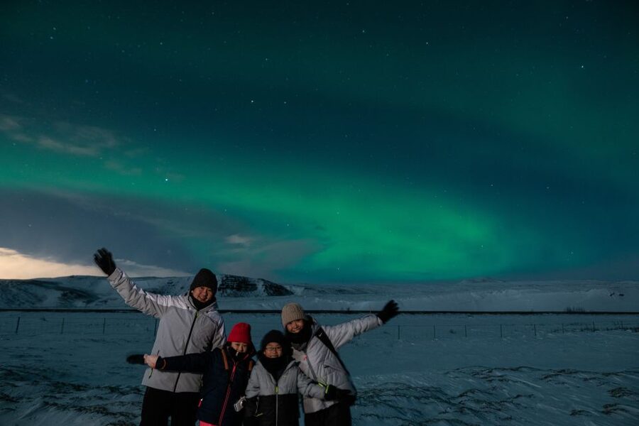 From Reykjavik: Northern Lights Guided Tour with Photos - Hot chocolate, snacks, and stargazing between aurora bursts