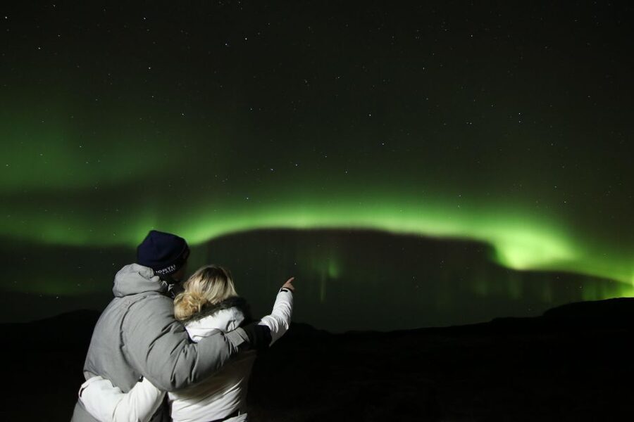 From Reykjavik: Northern Lights Tour with Hot Cocoa & Photos - Your warm-up kit: wool blankets, hot cocoa, and Kleina