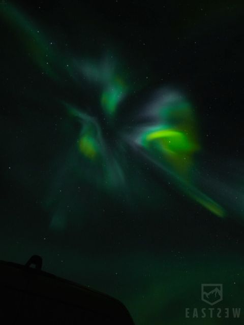 From Reykjavik: Northern Lights Tour with Hot Cocoa & Photos - How the guide hunts the aurora and sets you up for photos