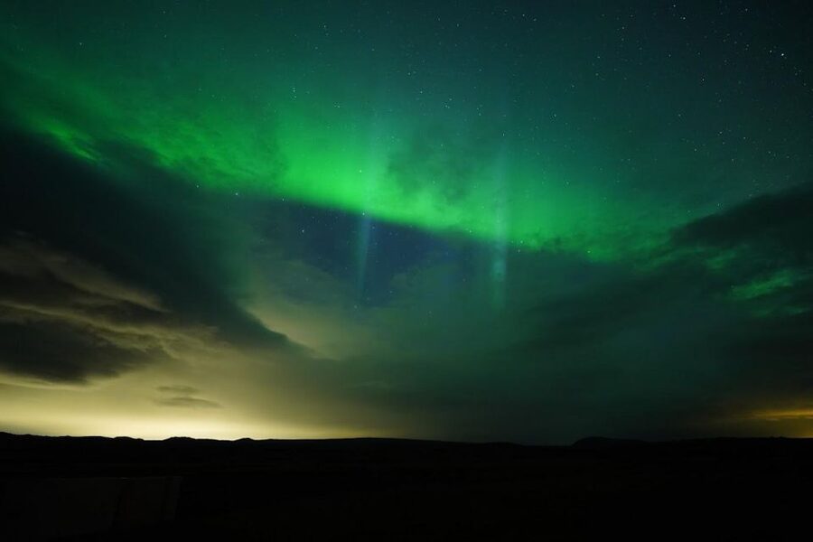 From Reykjavík: Northern Lights Tour with Hot Cocoa & Photos - Pickup in Miðborg, then 90 minutes out of town