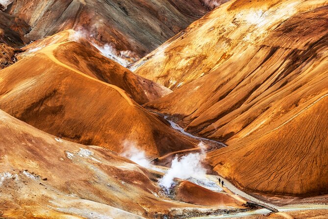 Kerlingarfjöll Day Hike from Reykjavik - Hveradalir geothermal valley: expect steam, color, and muddy footing