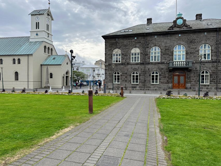 Reykjavik: City Walking tour in Small Group with Local Guide - Lake Tjörnin: colorful houses, close-to-home bird life