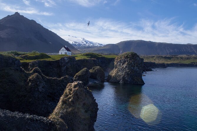 Snaefellsnes Small Group Tour with Homemade Meal from Reykjavik - Budakirkja and the Snæfellsjökull glacier: black church contrast and sci-fi vibes