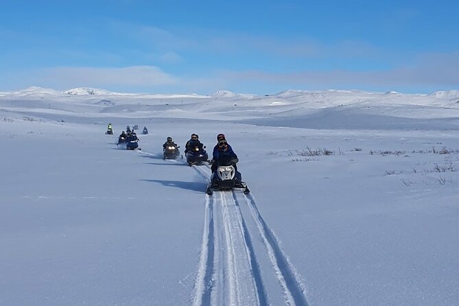 Snowmobile Tour by Lake Mývatn - Stop 1 on the ice: the views of Lake Mývatn and the lava-and-snow contrast